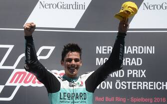 Spanish rider Joan Mir of Leopard Racing celebrates his victory on the podium after the Moto3 competition at the Grand Prix of Austria in Spielberg on August 14, 2016. / AFP / Michal Cizek        (Photo credit should read MICHAL CIZEK/AFP via Getty Images)