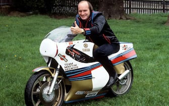 Mike Hailwood gives a thumbs up as he poses with the Yamaha TZ750 on which he intends to make his competitive motorcycling comeback.   (Photo by PA Images via Getty Images)