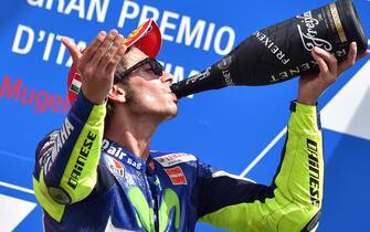 Italian MotoGP rider Valentino Rossi of the Movistar Yamaha team celebrates on the podium his third place in the Grand Prix of Italy at the Mugello circuit, Scarperia, central Italy, 31 May 2015.     ANSA/ETTORE FERRARI







