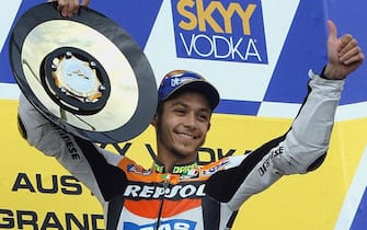 PHILLIP ISLAND, AUSTRALIA - OCTOBER 20:  World champion Valentino Rossi of Italy celebrates following his victory in the MotoGP race at the Australian Moto Grand Prix at Phillip Island, 20 October 2002. In a close-fought race, Rossi on his Honda beat Alex Barros of Brazil to the line in a time of 42'02.041.  (Photo credit should read KEITH MUIR/AFP via Getty Images)