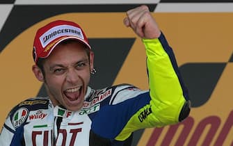 Moto GP rider Valentino Rossi of Italy celebrates in the podium at the end of the Grand Prix of Spain in Jerez de la Frontera on March 30, 2008. Dani Pedrosa took the first place followed by Valentino Rossi of Italy and Jorge Lorenzo of Spain. AFP PHOTO/ PIERRE-PHILIPPE MARCOU (Photo credit should read PIERRE-PHILIPPE MARCOU/AFP/Getty Images)