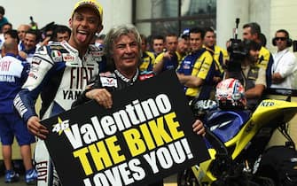 LE MANS, FRANCE - MAY 18:  Valentino Rossi of Italy and the Fiat Yamaha Team celebrates equalling the race win record of Angel Nieto (r) at the MotoGP of France at the Le Mans Circuit on May 18, 2008 in Le Mans, France.  (Photo by Bryn Lennon/Getty Images)
