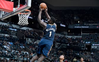 SAN ANTONIO, TX - OCTOBER 13: Zion Williamson #1 of the New Orleans Pelicans dunks the ball against the San Antonio Spurs during a pre-season game on October 13, 2019 at the AT&T Center in San Antonio, Texas. NOTE TO USER: User expressly acknowledges and agrees that, by downloading and or using this photograph, user is consenting to the terms and conditions of the Getty Images License Agreement. Mandatory Copyright Notice: Copyright 2019 NBAE (Photos by Logan Riely/NBAE via Getty Images)