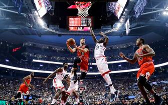 TORONTO, ONTARIO - OCTOBER 13: Zach LaVine #8 of the Chicago Bulls goes to the basket against Chris Boucher #25 of the Toronto Raptors during their NBA basketball pre-season game at Scotiabank Arena on October 13, 2019 in Toronto, Canada. NOTE TO USER: User expressly acknowledges and agrees that, by downloading and or using this photograph, User is consenting to the terms and conditions of the Getty Images License Agreement. (Photo by Mark Blinch/Getty Images)