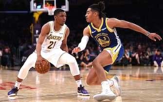 LOS ANGELES, CALIFORNIA - OCTOBER 14:  Zach Norvell Jr. #21 of the Los Angeles Lakers crosses over on Jordan Poole #3 of the Golden State Warriors during a 104-98 Lakers preseason win at Staples Center on October 14, 2019 in Los Angeles, California. (Photo by Harry How/Getty Images)