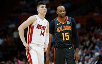 1181114046 MIAMI, FLORIDA - OCTOBER 14: Tyler Herro #14 of the Miami Heat looks on against Vince Carter #15 of the Atlanta Hawks during the second half of the preseason game at American Airlines Arena on October 14, 2019 in Miami, Florida. NOTE TO USER: User expressly acknowledges and agrees that, by downloading and or using this photograph, User is consenting to the terms and conditions of the Getty Images License Agreement. (Photo by Michael Reaves/Getty Images)
