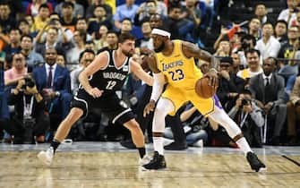 1180263638 SHANGHAI, CHINA - OCTOBER 10: LeBron James #23 of the Los Angeles Lakers handles the ball against Joe Harris #12 of the Brooklyn Nets during a preseason game as part of 2019 NBA Global Games China at Mercedes-Benz Arena on October 10, 2019 in Shanghai, China. NOTE TO USER: User expressly acknowledges and agrees that, by downloading and/or using this photograph, user is consenting to the terms and conditions of the Getty Images License Agreement. (Photo by Yanshan Zhang/Getty Images)