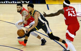 OAKLAND, CALIFORNIA - JUNE 13:  Stephen Curry #30 of the Golden State Warriors is defended by Fred VanVleet #23 and Pascal Siakam #43 of the Toronto Raptors in the second half during Game Six of the 2019 NBA Finals at ORACLE Arena on June 13, 2019 in Oakland, California. NOTE TO USER: User expressly acknowledges and agrees that, by downloading and or using this photograph, User is consenting to the terms and conditions of the Getty Images License Agreement. (Photo by Lachlan Cunningham/Getty Images)