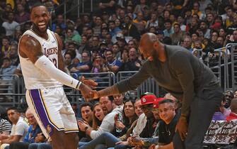 LOS ANGELES, CA - NOVEMBER 17: LeBron James #23 of the Los Angeles Lakers high fives NBA Legend, Kobe Bryant during the game against the Atlanta Hawks on November 17, 2019 at STAPLES Center in Los Angeles, California. NOTE TO USER: User expressly acknowledges and agrees that, by downloading and/or using this Photograph, user is consenting to the terms and conditions of the Getty Images License Agreement. Mandatory Copyright Notice: Copyright 2019 NBAE (Photo by Andrew D. Bernstein/NBAE via Getty Images)
