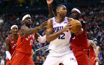 TORONTO, ON - NOVEMBER 25:  Al Horford #42 of the Philadelphia 76ers controls the ball against Terence Davis II #0 and Pascal Siakam #43 of the Toronto Raptors during the second half at Scotiabank Arena on November 25, 2019 in Toronto, Canada.  NOTE TO USER: User expressly acknowledges and agrees that, by downloading and or using this photograph, User is consenting to the terms and conditions of the Getty Images License Agreement.  (Photo by Vaughn Ridley/Getty Images)