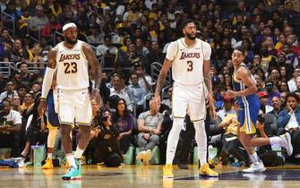 LOS ANGELES, CA - OCTOBER 16: LeBron James #23 and Anthony Davis #3 of the Los Angeles Lakers look on during a pre-season game against the Golden State Warriors on October 16, 2019 at STAPLES Center in Los Angeles, California. NOTE TO USER: User expressly acknowledges and agrees that, by downloading and/or using this Photograph, user is consenting to the terms and conditions of the Getty Images License Agreement. Mandatory Copyright Notice: Copyright 2019 NBAE (Photo by Andrew D. Bernstein/NBAE via Getty Images) 