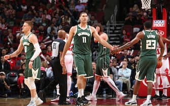 MILWAUKEE, WI - OCTOBER 7: Brook Lopez #11  of Milwaukee Bucks high-fives Sterling Brown #23 of Milwaukee Bucks against the Chicago Bulls on October 7, 2019 at the United Center in Chicago, Illinois. NOTE TO USER: User expressly acknowledges and agrees that, by downloading and or using this Photograph, user is consenting to the terms and conditions of the Getty Images License Agreement. Mandatory Copyright Notice: Copyright 2019 NBAE (Photo by Gary Dineen/NBAE via Getty Images).