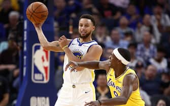 SAN FRANCISCO, CALIFORNIA - OCTOBER 05:  Stephen Curry #30 of the Golden State Warriors looks to pass around Rajon Rondo #9 of the Los Angeles Lakers at Chase Center on October 05, 2019 in San Francisco, California.  NOTE TO USER: User expressly acknowledges and agrees that, by downloading and or using this photograph, User is consenting to the terms and conditions of the Getty Images License Agreement.  (Photo by Ezra Shaw/Getty Images)