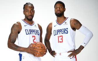 PLAYA VISTA, CA - SEPTEMBER 29: Kawhi Leonard #2 and Paul George #13 of the LA Clippers pose for a portrait during media day on September 29, 2019 at the Honey Training Center: Home of the LA Clippers in Playa Vista, California. NOTE TO USER: User expressly acknowledges and agrees that, by downloading and/or using this photograph, user is consenting to the terms and conditions of the Getty Images License Agreement. Mandatory Copyright Notice: Copyright 2019 NBAE (Photo by Andrew D. Bernstein/NBAE via Getty Images)