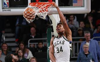 MILWAUKEE, WI - OCTOBER 17: Giannis Antetokounmpo #34 of the Milwaukee Bucks dunks the ball during a pre-season game against the Minnesota Timberwolves on October 17 , 2019 at the Fiserv Forum Center in Milwaukee, Wisconsin. NOTE TO USER: User expressly acknowledges and agrees that, by downloading and or using this Photograph, user is consenting to the terms and conditions of the Getty Images License Agreement. Mandatory Copyright Notice: Copyright 2019 NBAE (Photo by Gary Dineen/NBAE via Getty Images).