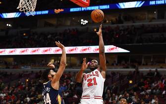 CHICAGO, ILLINOIS - OCTOBER 09:  Thaddeus Young #21 of the Chicago Bulls shoots over Kenrich Williams #34 of the New Orleans Pelicans during the second half of a preseason game at the United Center on October 09, 2019 in Chicago, Illinois. NOTE TO USER: User expressly acknowledges and agrees that, by downloading and or using this photograph, User is consenting to the terms and conditions of the Getty Images License Agreement. (Photo by Stacy Revere/Getty Images)