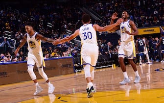SAN FRANCISCO, CA - OCTOBER 10: D'Angelo Russell #0, Stephen Curry #30, and Glenn Robinson III #22 of the Golden State Warriors high-five during a pre-season game against the Minnesota Timberwolves on October 10, 2019 at Chase Center in San Francisco, California. NOTE TO USER: User expressly acknowledges and agrees that, by downloading and/or using this Photograph, user is consenting to the terms and conditions of the Getty Images License Agreement. Mandatory Copyright Notice: Copyright 2019 NBAE (Photo by Noah Graham/NBAE via Getty Images) 