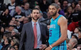 1087026420 SACRAMENTO, CA - JANUARY 12: Head coach James Borrego of the Charlotte Hornets talks to Nicolas Batum #5 during the game against the Sacramento Kings on January 12, 2019 at Golden 1 Center in Sacramento, California. NOTE TO USER: User expressly acknowledges and agrees that, by downloading and or using this photograph, User is consenting to the terms and conditions of the Getty Images Agreement. Mandatory Copyright Notice: Copyright 2019 NBAE (Photo by Rocky Widner/NBAE via Getty Images)