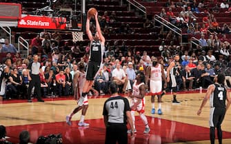 HOUSTON, TX - OCTOBER 16: Jakob Poeltl #25 of the San Antonio Spurs shoots the ball against the Houston Rockets during a pre-season game on October 16, 2019 at the Toyota Center in Houston, Texas. NOTE TO USER: User expressly acknowledges and agrees that, by downloading and or using this photograph, User is consenting to the terms and conditions of the Getty Images License Agreement. Mandatory Copyright Notice: Copyright 2019 NBAE (Photo by Bill Baptist/NBAE via Getty Images)