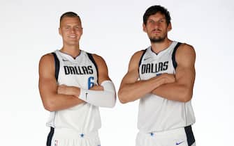 DALLAS, TX - SEPTEMBER 30: Kristaps Porzingis #6 and Boban Marjanovic #51 of the Dallas Mavericks pose for a portrait during Media Day on September 30, 2019 at the American Airlines Center in Dallas, Texas. NOTE TO USER: User expressly acknowledges and agrees that, by downloading and or using this photograph, User is consenting to the terms and conditions of the Getty Images License Agreement. Mandatory Copyright Notice: Copyright 2019 NBAE (Photo by Glenn James/NBAE via Getty Images)