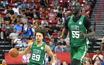 LAS VEGAS, NEVADA - JULY 11:  Carsen Edwards #29 of the Boston Celtics brings the ball up the court alongside teammate Tacko Fall #55 during a game against the Memphis Grizzlies during the 2019 NBA Summer League at the Thomas & Mack Center on July 11, 2019 in Las Vegas, Nevada. The Celtics defeated the Grizzlies 113-87. NOTE TO USER: User expressly acknowledges and agrees that, by downloading and or using this photograph, User is consenting to the terms and conditions of the Getty Images License Agreement.  (Photo by Ethan Miller/Getty Images)