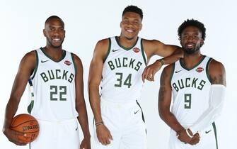 MILWAUKEE, WI - SEPTEMBER 30: Khris Middleton #22, Giannis Antetokounmpo #34 and Wesley Matthews #9 of the Milwaukee Bucks pose for a portrait during Media Day at Fiserv Forum on September 30, 2019 in Milwaukee, Wisconsin. NOTE TO USER: User expressly acknowledges and agrees that, by downloading and/or using this photograph, user is consenting to the terms and conditions of the Getty Images License Agreement.  Mandatory Copyright Notice: Copyright 2019 NBAE (Photo by Gary Dineen/NBAE via Getty Images)