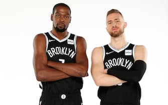 BROOKLYN, NY - SEPTEMBER 27: Kevin Durant #7 and  Dzanan Musa #13 of the Brooklyn Nets pose for a portrait during media day on September 27, 2019 at the HSS Training Center in Brooklyn, New York. NOTE TO USER: User expressly acknowledges and agrees that, by downloading and/or using this photograph, user is consenting to the terms and conditions of the Getty Images License Agreement. Mandatory Copyright Notice: Copyright 2019 NBAE (Photo by Nathaniel S. Butler/NBAE via Getty Images)