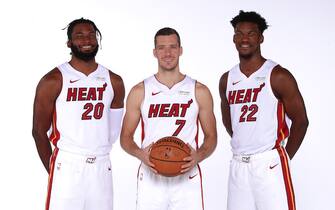 MIAMI, FL - September 30: Justise Winslow #20, Goran Dragic #7, and Jimmy Butler #22 of the Miami Heat pose for a portrait during the 2019 Media Day at American Airlines Arena on September 30, 2019 in Miami, Florida. NOTE TO USER: User expressly acknowledges and agrees that, by downloading and/or using this photograph, user is consenting to the terms and conditions of the Getty Images License Agreement. Mandatory copyright notice: Copyright NBAE 2019 (Photo by Issac Baldizon/NBAE via Getty Images)