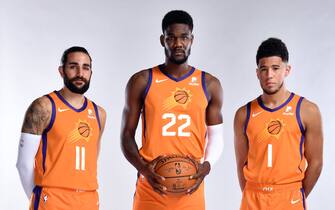PHOENIX, AZ - SEPTEMBER 30: Ricky Rubio #11, Deandre Ayton #22, and Devin Booker #1 of the Phoenix Suns poses for a portrait during media day on September 30, 2019 at Talking Stick Resort Arena in Phoenix, Arizona. NOTE TO USER: User expressly acknowledges and agrees that, by downloading and or using this Photograph, user is consenting to the terms and conditions of the Getty Images License Agreement. Mandatory Copyright Notice: Copyright 2019 NBAE (Photo by Barry Gossage NBAE via Getty Images)