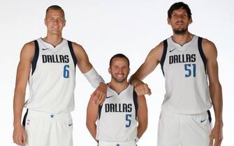DALLAS, TX - SEPTEMBER 30: Kristaps Porzingis #6, J.J. Barea #5 and Boban Marjanovic #51 of the Dallas Mavericks pose for a portrait during Media Day on September 30, 2019 at the American Airlines Center in Dallas, Texas. NOTE TO USER: User expressly acknowledges and agrees that, by downloading and or using this photograph, User is consenting to the terms and conditions of the Getty Images License Agreement. Mandatory Copyright Notice: Copyright 2019 NBAE (Photo by Glenn James/NBAE via Getty Images)