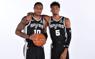 SAN ANTONIO, TX - SEPTEMBER 30: DeMar DeRozan #10 and Dejounte Murray #5 of the San Antonio Spurs pose for a portrait during media day on September 30, 2019 at the Spurs Practice Facility in San Antonio, Texas. NOTE TO USER: User expressly acknowledges and agrees that, by downloading and/or using this photograph, user is consenting to the terms and conditions of the Getty Images License Agreement. Mandatory Copyright Notice: Copyright 2019 NBAE (Photo by Logan Riely/NBAE via Getty Images)
