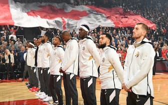 TORONTO, CANADA - OCTOBER 22: The Toronto Raptors stand for the National Anthem before the game against the New Orleans Pelicans on October 22, 2019 at the Scotiabank Arena in Toronto, Ontario, Canada. NOTE TO USER: User expressly acknowledges and agrees that, by downloading and or using this Photograph, user is consenting to the terms and conditions of the Getty Images License Agreement.  Mandatory Copyright Notice: Copyright 2019 NBAE (Photo by Ron Turenne/NBAE via Getty Images)