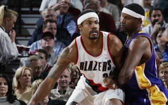 PORTLAND - OCTOBER 30:  Rasheed Wallace #30 of the Portland Trail Blazers moves the ball defended by Samaki Walker #52 of the Los Angeles Lakers during the game at the Rose Garden on October 30, 2002 in Portland, Oregon.  The Blazers won 102-90.  NOTE TO USER: User expressly acknowledges and agrees that, by downloading and/or using this Photograph, User is consenting to the terms and conditions of the Getty Images License Agreement Mandatory Copyright Notice:  Copyright 2002 NBAE  (Photo by Sam Forencich/NBAE via Getty Images) 