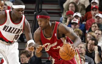 PORTLAND, OR - NOVEMBER 1:  LeBron James #23 of the Cleveland Cavaliers drives Zach Randolph #50 of the Portland Trail Blazers November 1, 2003  at the Rose Garden Arena in Portland, Oregon.  NOTE TO USER: User expressly acknowledges and agrees that, by downloading and/or using this Photograph, User is consenting to the terms and conditions of the Getty Images License Agreement.  (Photo by Sam Forencich/NBAE via Getty Images)