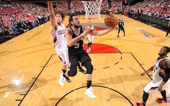 PORTLAND, OR - MAY 12:   Marco Belinelli #3 of the San Antonio Spurs drives to the basket against the Portland Trail Blazers in Game Four of the Western Conference Semifinals during the 2014 NBA Playoffs on May 12, 2014 at the Moda Center in Portland, Oregon. NOTE TO USER: User expressly acknowledges and agrees that, by downloading and/or using this Photograph, user is consenting to the terms and conditions of the Getty Images License Agreement. Mandatory Copyright Notice: Copyright 2013 NBAE (Photo by Garrett W. Ellwood/NBAE via Getty Images)