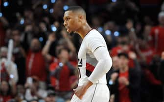 PORTLAND, OR - SEPTEMBER 25: Damian Lillard #0 of the Portland Trail Blazers celebrates after hitting a three point shot late in the fourth quarter of an NBA game against the Utah Jazzat the Moda Center on September 25, 2016 in Portland, Oregon. Lillard scored 39 points as the Blazers won 113-104. NOTE TO USER: User expressly acknowledges and agrees that by downloading and/or using this photograph, user is consenting to the terms and conditions of the Getty Images License Agreement.  (Photo by Steve Dykes/Getty Images)