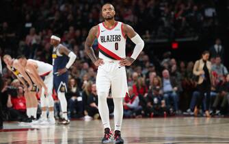 PORTLAND, OREGON - OCTOBER 23: Damian Lillard #0 of the Portland Trail Blazers reacts in the third quarter against the Denver Nuggets during their season opener at Moda Center on October 23, 2019 in Portland, Oregon. NOTE TO USER: User expressly acknowledges and agrees that, by downloading and or using this photograph, User is consenting to the terms and conditions of the Getty Images License Agreement (Photo by Abbie Parr/Getty Images)