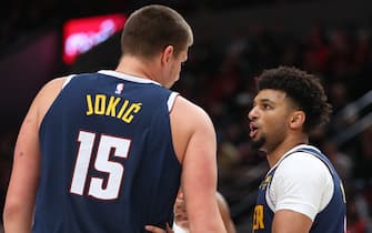PORTLAND, OREGON - OCTOBER 23: Jamal Murray #27 has a conversation with Nikola Jokic #15 of the Denver Nuggets in the first quarter against the Portland Trail Blazers during their season opener at Moda Center on October 23, 2019 in Portland, Oregon. NOTE TO USER: User expressly acknowledges and agrees that, by downloading and or using this photograph, User is consenting to the terms and conditions of the Getty Images License Agreement (Photo by Abbie Parr/Getty Images)