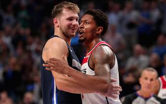 DALLAS, TEXAS - OCTOBER 23: Bradley Beal #3 of the Washington Wizards hugs Luka Doncic #77 of the Dallas Mavericks after being ejected from the game in the fourth quarter at American Airlines Center on October 23, 2019 in Dallas, Texas. NOTE TO USER: User expressly acknowledges and agrees that, by downloading and or using this photograph, User is consenting to the terms and conditions of the Getty Images License Agreement.
 (Photo by Tom Pennington/Getty Images)
