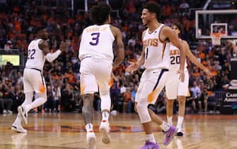 PHOENIX, ARIZONA - OCTOBER 23: Devin Booker #1 of the Phoenix Suns high fives Kelly Oubre Jr. #3 after scoring against the Sacramento Kings during the second half of the NBA game at Talking Stick Resort Arena on October 23, 2019 in Phoenix, Arizona. The Suns defeated the Kings 124-95. NOTE TO USER: User expressly acknowledges and agrees that, by downloading and/or using this photograph, user is consenting to the terms and conditions of the Getty Images License Agreement (Photo by Christian Petersen/Getty Images)