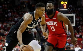 HOUSTON, TX - OCTOBER 24: Giannis Antetokounmpo #34 of the Milwaukee Bucks drives to the basket defended by James Harden #13 of the Houston Rockets in the first half at Toyota Center on October 24, 2019 in Houston, Texas. NOTE TO USER: User expressly acknowledges and agrees that, by downloading and or using this photograph, User is consenting to the terms and conditions of the Getty Images License Agreement. (Photo by Tim Warner/Getty Images)