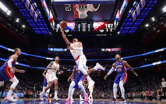DETROIT, MICHIGAN - OCTOBER 24: Trae Young #11 of the Atlanta Hawks drives to the basket past Derrick Rose #25 of the Detroit Pistons during the second half at Little Caesars Arena on October 24, 2019 in Detroit, Michigan. NOTE TO USER: User expressly acknowledges and agrees that, by downloading and/or using this photograph, user is consenting to the terms and conditions of the Getty Images License Agreement. (Photo by Gregory Shamus/Getty Images) (Photo by Gregory Shamus/Getty Images)
