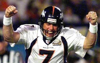 MIAMI, :  Denver Broncos quarterback John Elway pumps his fists in celebration of Howard Griffith's second half touchdown during Super Bowl XXXIII 31 January at Pro Player Stadium in Miami, FL. The Broncos defeated the Atlanta Falcons 34-19 for their second consecutive NFL championship.   (ELECTRONIC IMAGE)   AFP PHOTO (Photo credit should read JEFF HAYNES/AFP via Getty Images)