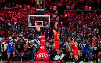 ATLANTA, GA - OCTOBER 26: Trae Young #11 of the Atlanta Hawks hits the game winning 3 pointer against the Orlando Magic on October 26 26, 2019 at State Farm Arena in Atlanta, Georgia.  NOTE TO USER: User expressly acknowledges and agrees that, by downloading and/or using this Photograph, user is consenting to the terms and conditions of the Getty Images License Agreement. Mandatory Copyright Notice: Copyright 2019 NBAE (Photo by Scott Cunningham/NBAE via Getty Images)