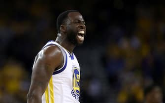 OAKLAND, CALIFORNIA - APRIL 13:   Draymond Green #23 of the Golden State Warriors reacts after he made a basket against the LA Clippers during Game One of the first round of the 2019 NBA Western Conference Playoffs at ORACLE Arena on April 13, 2019 in Oakland, California. NOTE TO USER: User expressly acknowledges and agrees that, by downloading and or using this photograph, User is consenting to the terms and conditions of the Getty Images License Agreement. (Photo by Ezra Shaw/Getty Images)
