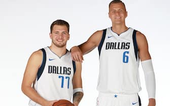 DALLAS, TX - SEPTEMBER 30: Luka Doncic #77 and Kristaps Porzingis #6 of the Dallas Mavericks pose for a portrait during Media Day on September 30, 2019 at the American Airlines Center in Dallas, Texas. NOTE TO USER: User expressly acknowledges and agrees that, by downloading and or using this photograph, User is consenting to the terms and conditions of the Getty Images License Agreement. Mandatory Copyright Notice: Copyright 2019 NBAE (Photo by Glenn James/NBAE via Getty Images)