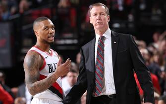 PORTLAND, OR - APRIL 14: Head Coach, Terry Stotts, and Damian Lillard #0 of the Portland Trail Blazers talk against the Oklahoma City Thunder during Game One of Round One of the 2019 NBA Playoffs on April 14, 2019 at the Moda Center Arena in Portland, Oregon. NOTE TO USER: User expressly acknowledges and agrees that, by downloading and or using this photograph, user is consenting to the terms and conditions of the Getty Images License Agreement. Mandatory Copyright Notice: Copyright 2019 NBAE (Photo by Sam Forencich/NBAE via Getty Images)