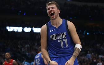 1183862681 DALLAS, TEXAS - OCTOBER 27: Luka Doncic #77 of the Dallas Mavericks reacts after being fouled by Hassan Whiteside #21 of the Portland Trail Blazers in the second half at American Airlines Center on October 27, 2019 in Dallas, Texas. NOTE TO USER: User expressly acknowledges and agrees that, by downloading and or using this photograph, User is consenting to the terms and conditions of the Getty Images License Agreement. (Photo by Ronald Martinez/Getty Images)
