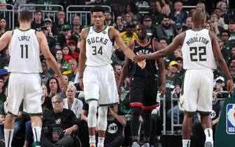 MILWAUKEE, WI - MAY 17: Giannis Antetokounmpo #34 and Khris Middleton #22 of the Milwaukee Bucks high five during Game Two of the Eastern Conference Finals against the Toronto Raptors on May 17, 2019 at the Fiserv Forum in Milwaukee, Wisconsin. NOTE TO USER: User expressly acknowledges and agrees that, by downloading and/or using this photograph, user is consenting to the terms and conditions of the Getty Images License Agreement. Mandatory Copyright Notice: Copyright 2019 NBAE (Photo by Nathaniel S. Butler/NBAE via Getty Images)