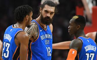 LOS ANGELES, CA - MARCH 08: Terrance Ferguson #23, Steven Adams #12 and Dennis Schroder #17 of the Oklahoma City Thunder have a conversation while playing the Los Angeles Clippers at Staples Center on March 8, 2019 in Los Angeles, California. NOTE TO USER: User expressly acknowledges and agrees that, by downloading and or using this photograph, User is consenting to the terms and conditions of the Getty Images License Agreement.(Photo by John McCoy/Getty Images)